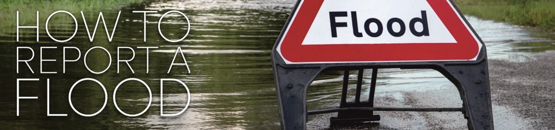 "Flood" sign on flooded road